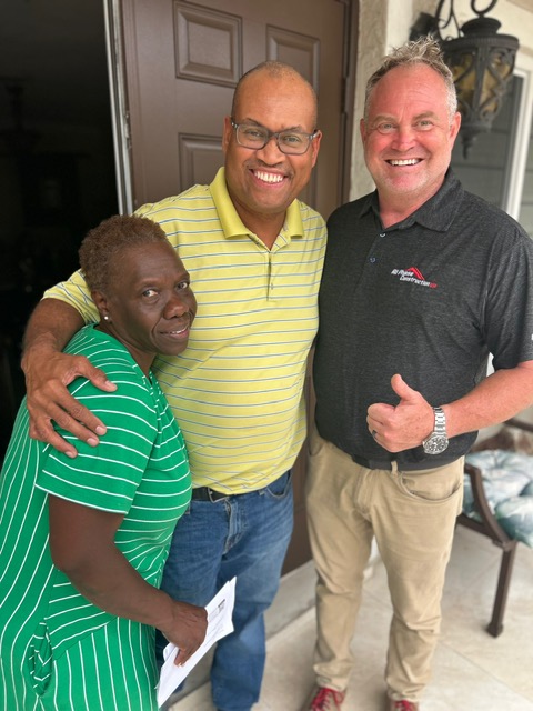 Happy customer after roof installation in Coral Springs