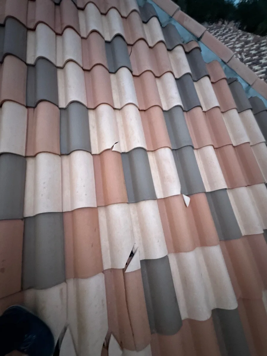 Cracked and slipped clay roof tiles found during a roof inspection in West Palm Beach, FL