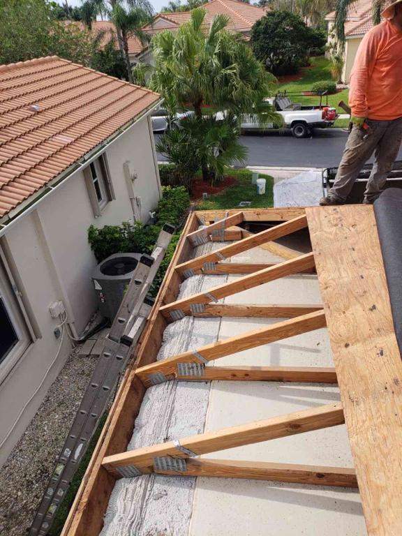 Hurricane straps and roof-to-wall connections installed for HVHZ wind resistance in South Florida