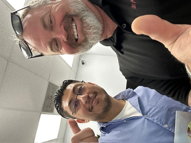 Happy homeowner in South Florida after shingle roof installation