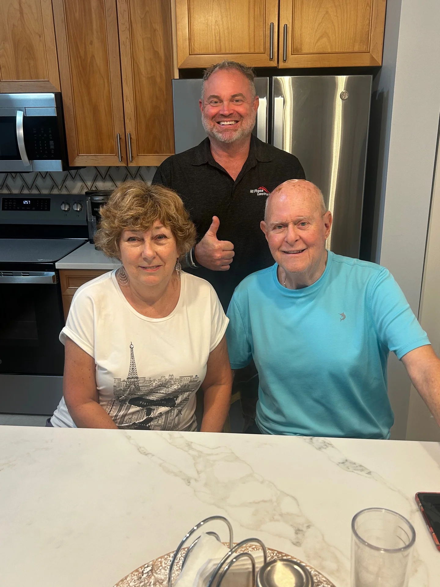 Satisfied homeowners after wind mitigation inspection and roof upgrade in South Florida