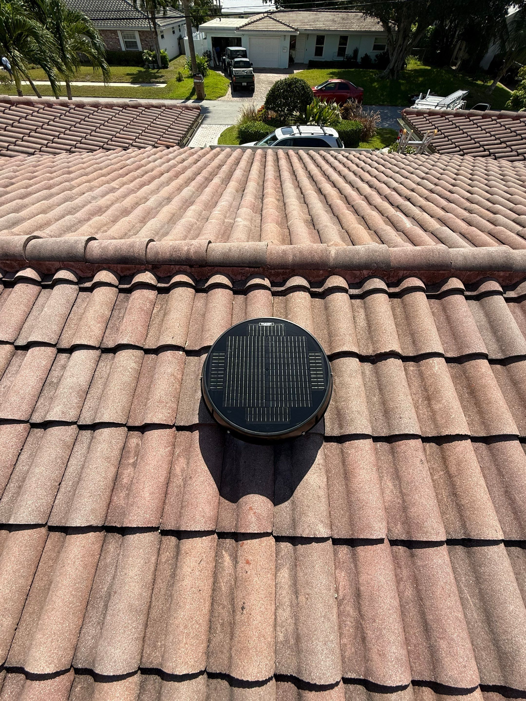 HVHZ-rated solar attic fan installed on tile roof in South Florida providing hurricane-resistant roof ventilation