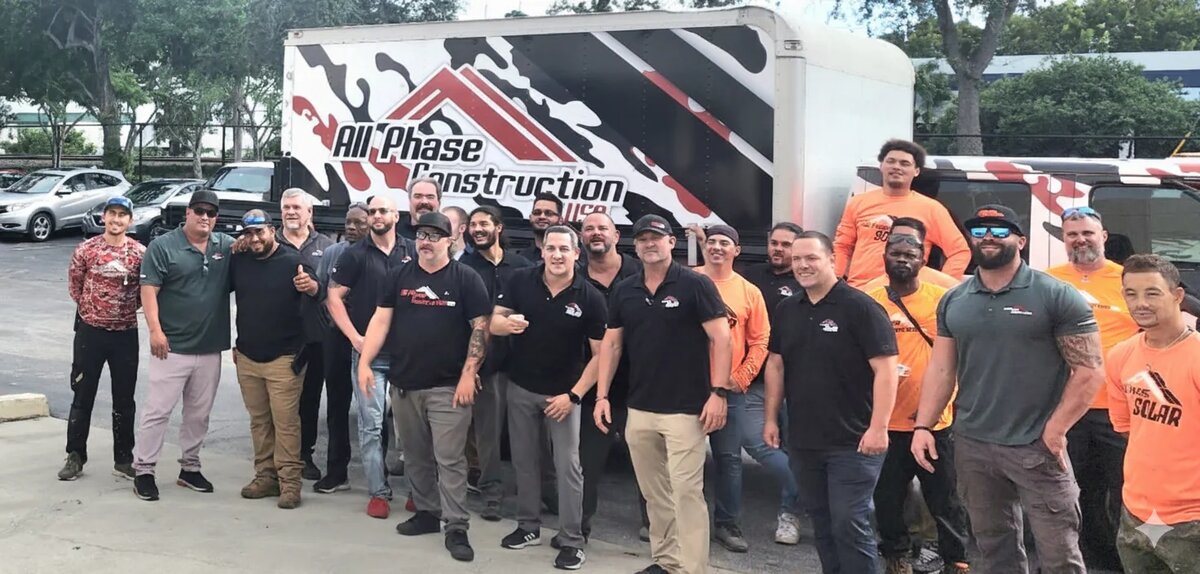 All Phase Construction team in front of company truck