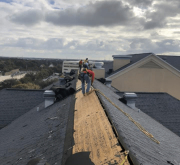 TEam Work on a Shingle Roof