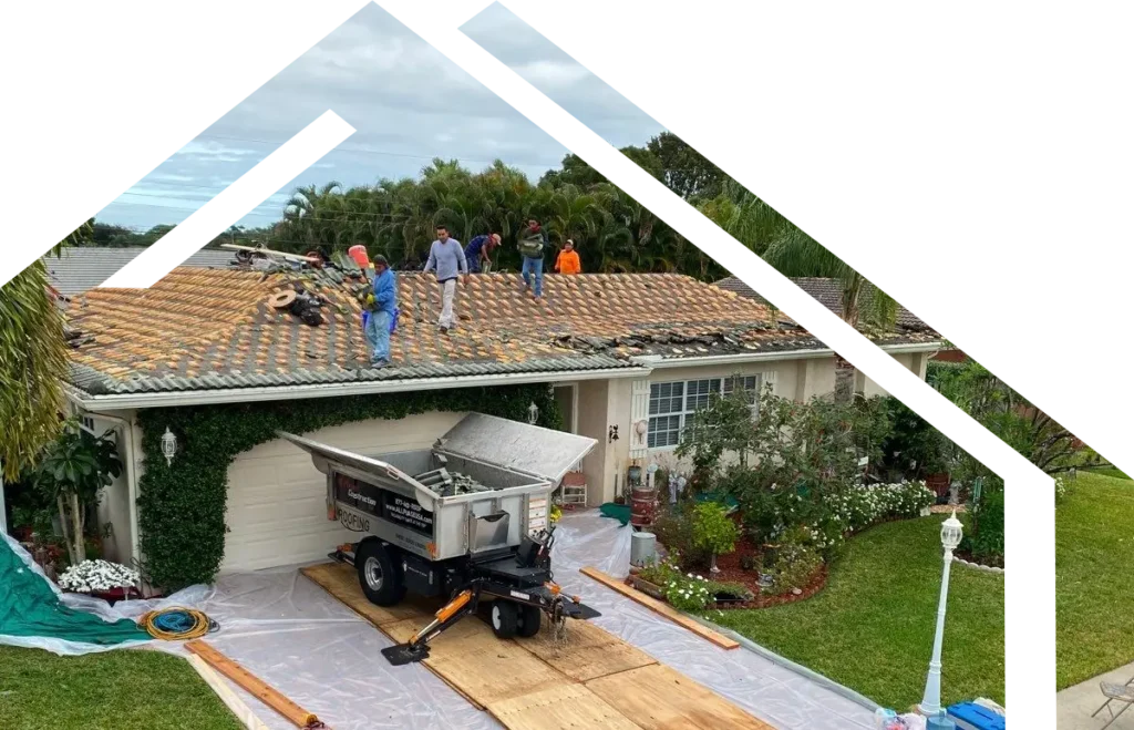 Roofing team repairing a residential roof